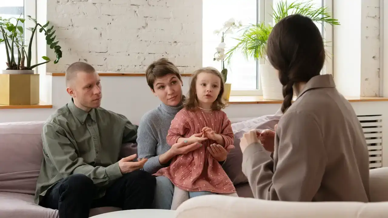 professional providing family planning advice to couple in counseling